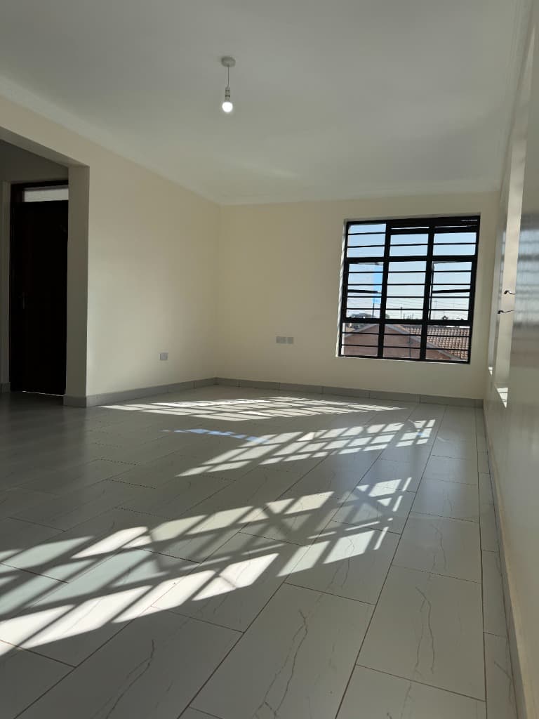 Spacious bedroom with natural sunlight